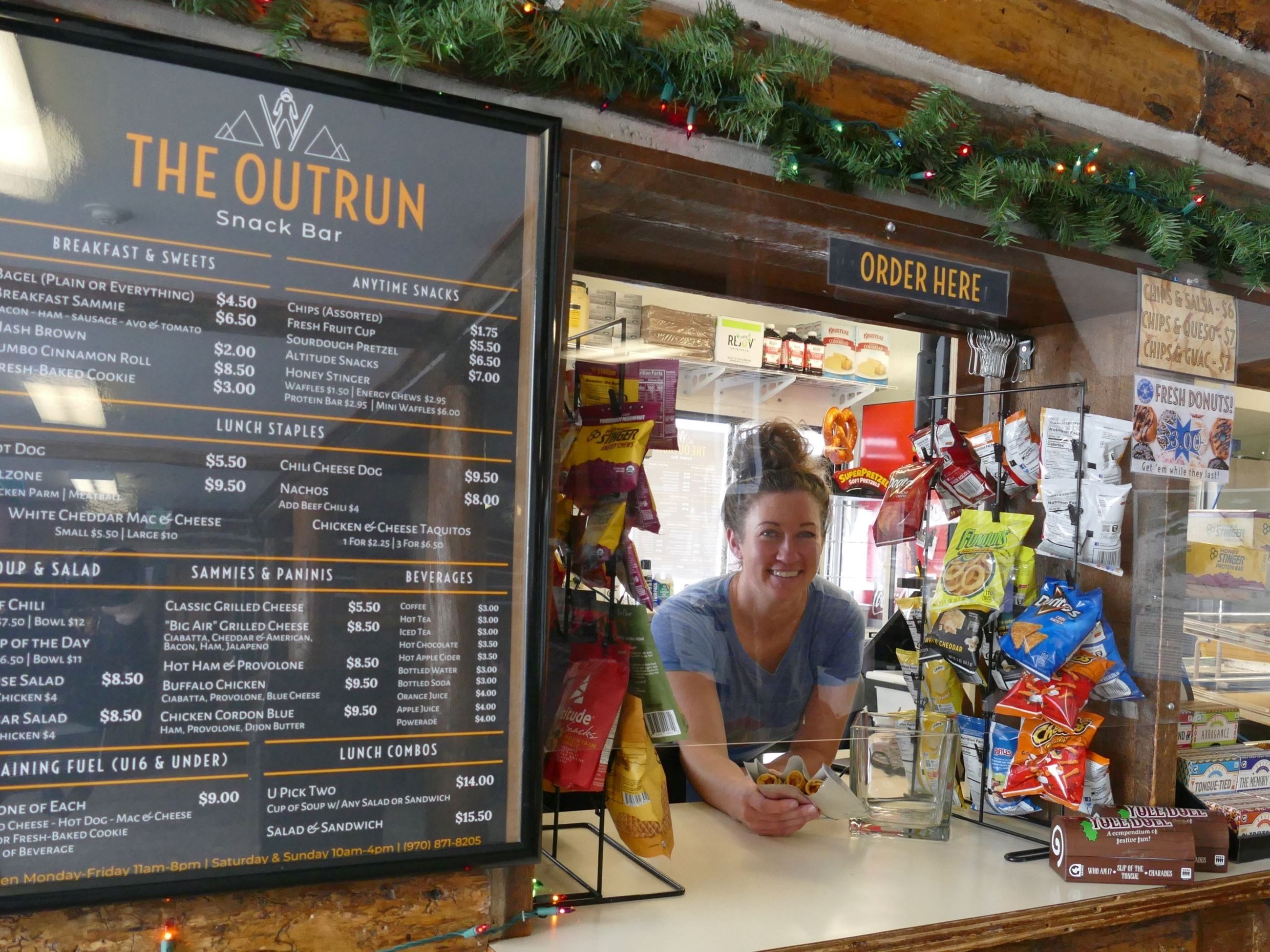 Staff member ready to help at the Outrun ordering window