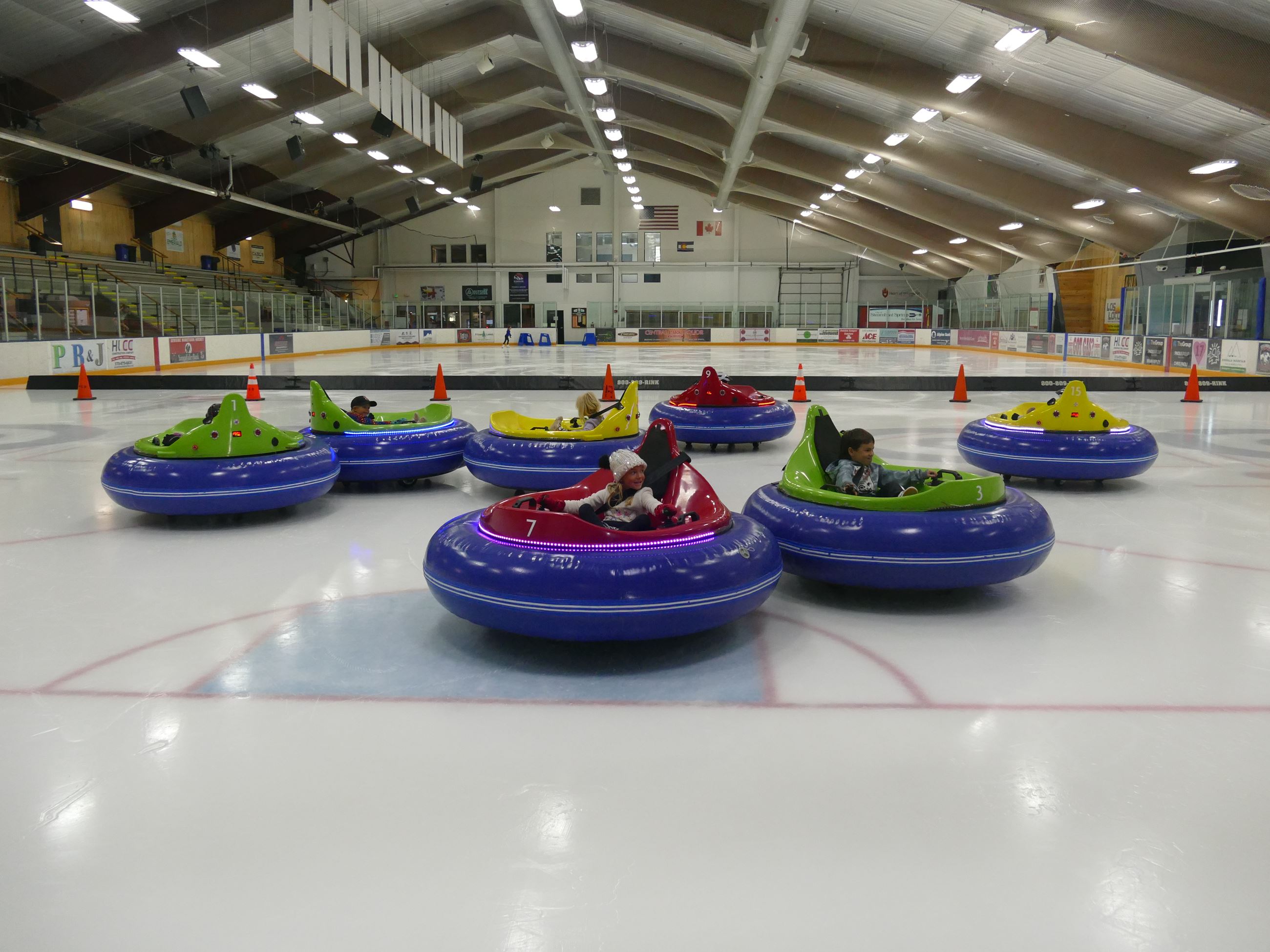 Kids enjoying bumper cars on ice