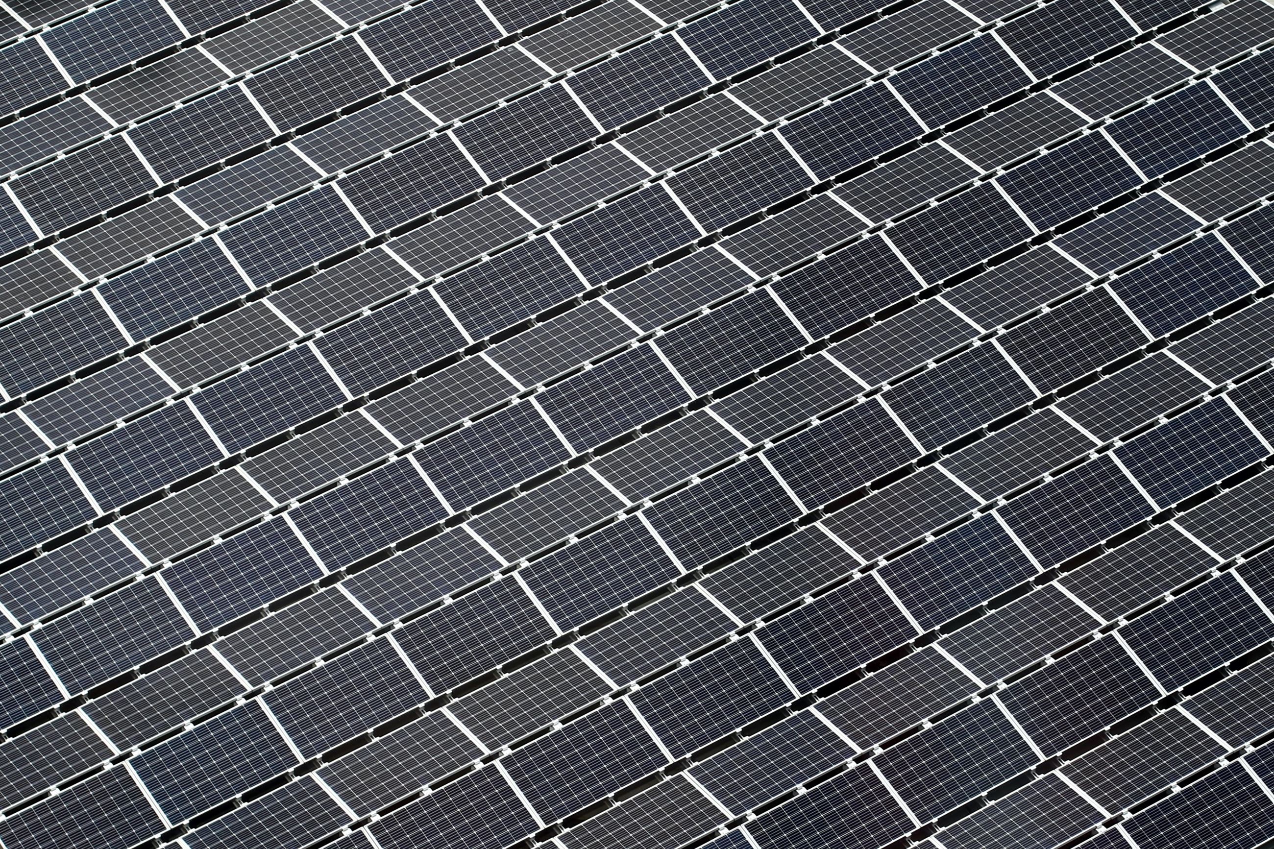 Aerial view of many solar panels